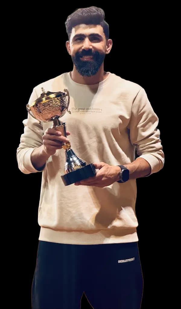 Ahmed Samra holding a trophy